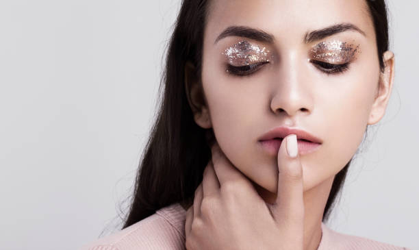 Close-up texture of cosmetic-grade lady glitter sparkles